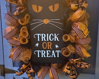 Bus eller godis svart katt Halloweenkrans
