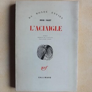May include: A white book cover with black text that reads "Du Monde Entier" and "L'Aciaigle". The author's name is listed as "Irvin Faust". The book is a novel translated from English by Andre Simon. The cover features a black and white illustration of a geometric shape.