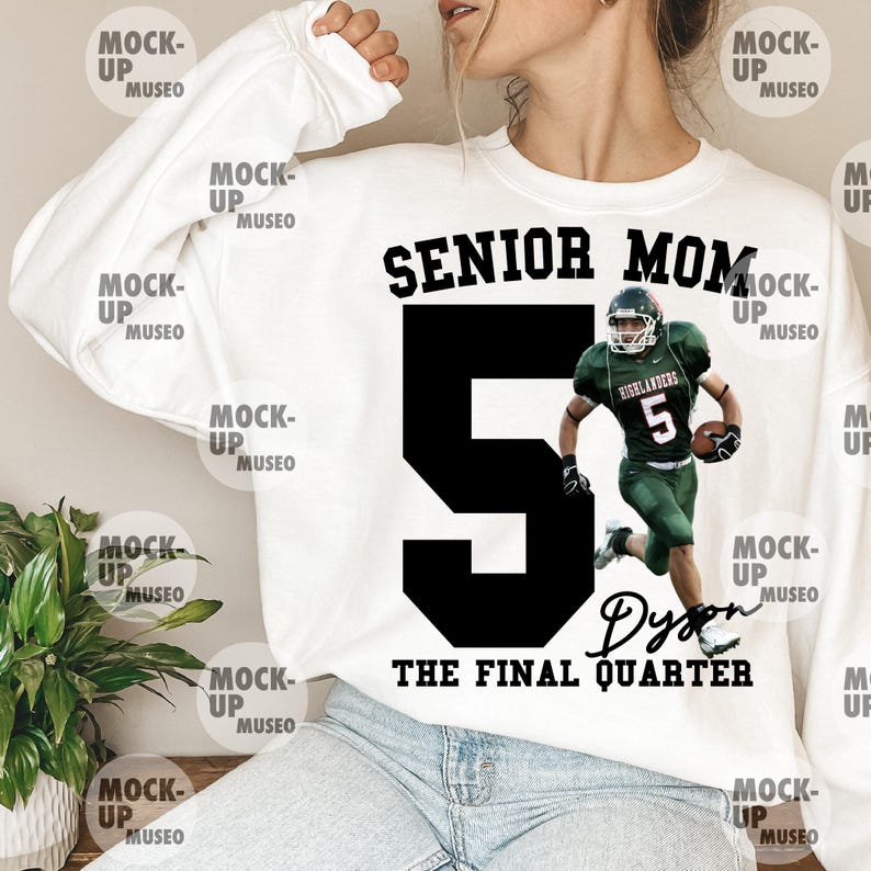 May include: White sweatshirt featuring the text "SENIOR MOM" above a large black number 5 and a football player in green and white uniform. The text "THE FINAL QUARTER" and a name are below the number. A casual, sporty design.