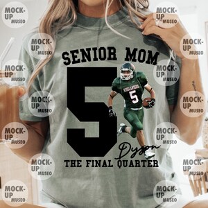 May include: Sage green t-shirt with the text "SENIOR MOM" above a large black number 5. A football player in a green uniform is superimposed on the shirt. The text "Dyson" and "THE FINAL QUARTER" are below the number.