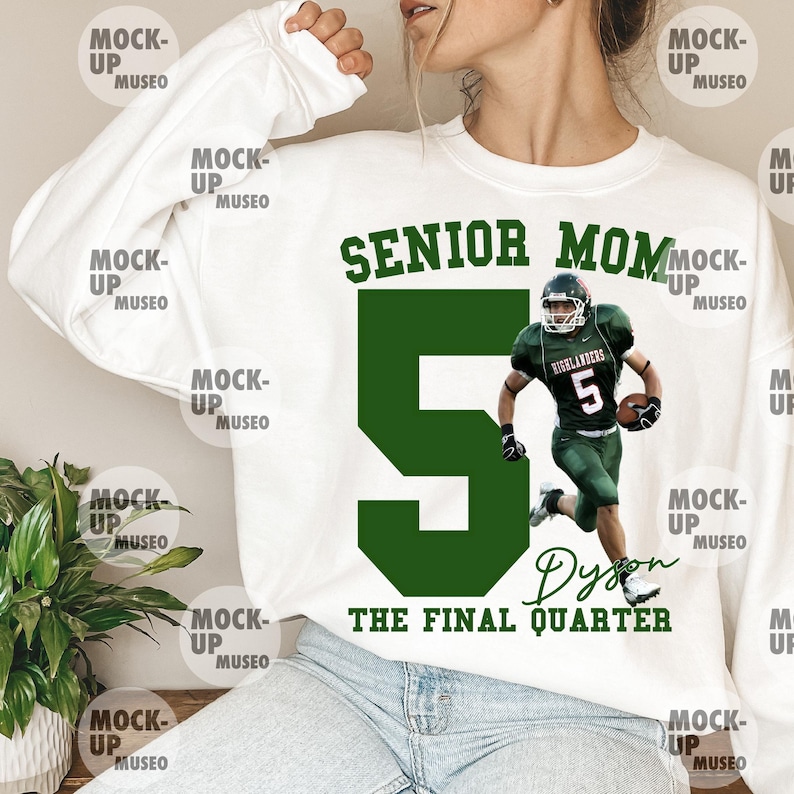 May include: White sweatshirt with a green "5" and the words "SENIOR MOM" and "THE FINAL QUARTER". A football player in a green uniform is pictured on the front. The name "Dyson" is written in cursive below the player.