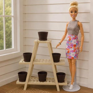 May include: A three-tiered wooden plant stand with six brown flower pots. A doll in a grey top and floral skirt stands beside it. The stand is light-coloured, and the pots are dark brown.