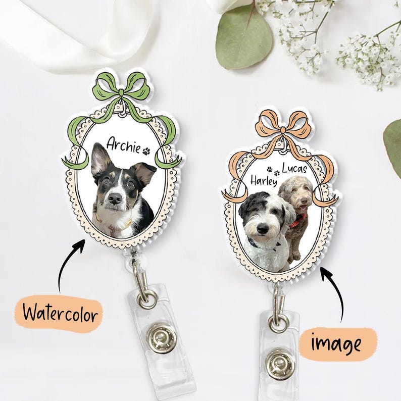 May include: Two personalised pet ID badge reels. One features a watercolour portrait of a dog named Archie, the other has a photo of two dogs named Harley and Lucas. Each has a decorative bow and scalloped edge.