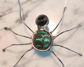 Pequeña araña de vitral con canica tiradora y canica normal