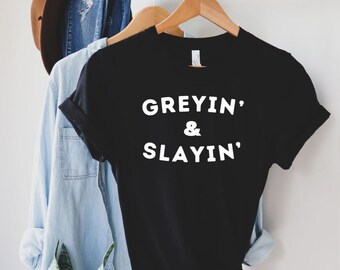 Greyin&#39; and Slayin&#39; Tshirt, Feminist Shirt, Female Empowerment Shirt, Funny Shirt, Aging Shirt, Premium Unisex Crewneck T-shirt