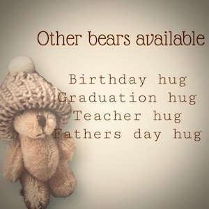 May include: A brown teddy bear wearing a knitted hat with a white pom-pom. The text "Other bears available" is at the top of the image. Below the bear, the text reads "Birthday hug, Graduation hug, Teacher hug, Fathers day hug."