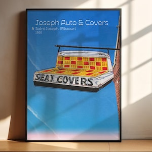 May include: A vintage sign for Joseph Auto & Covers in Saint Joseph, Missouri. The sign is a white metal structure with red and yellow checkered seat covers and the words "Seat Covers" in black letters.