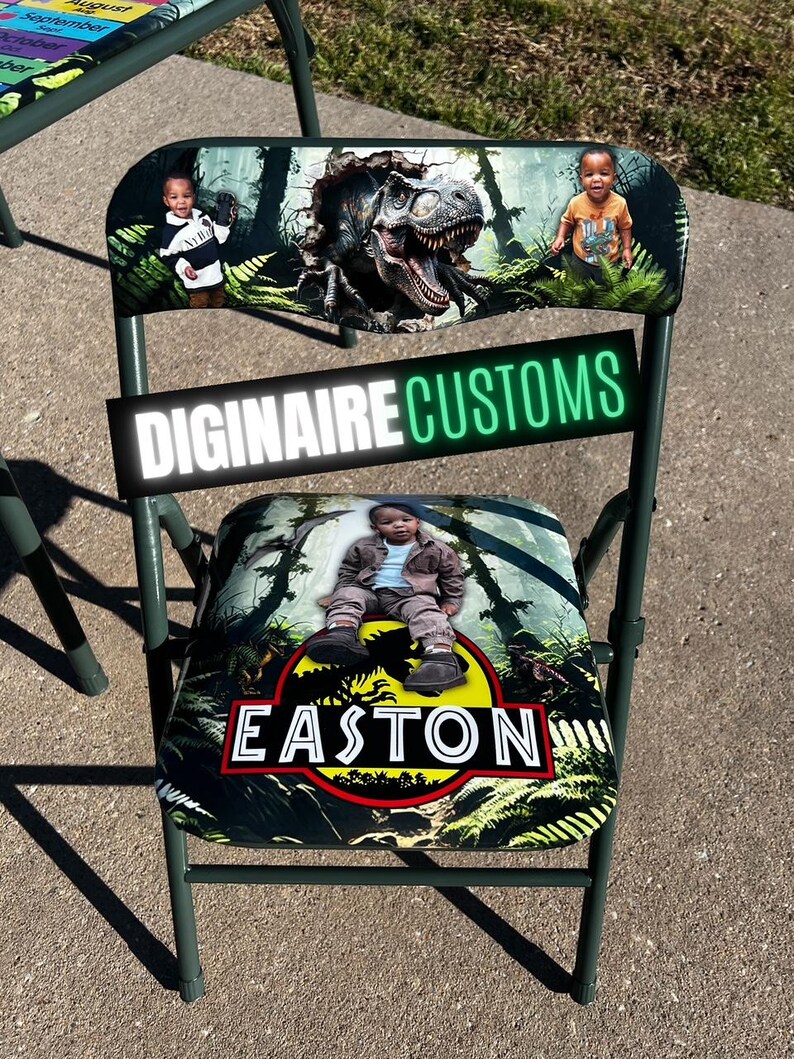 May include: A green folding chair with a custom design featuring a dinosaur and the name "Easton". The chair's backrest displays a T-Rex illustration and two children. The text "DIGINAIRE CUSTOMS" is also visible.