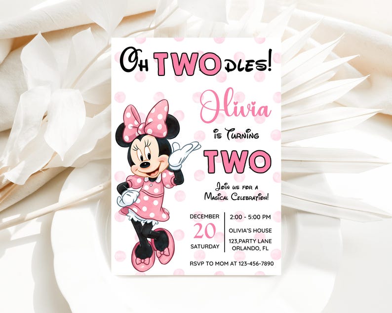 May include: A pink and white invitation featuring Minnie Mouse. The invitation reads "Oh TWODLES! Olivia is Turning TWO" with event details. Minnie Mouse is wearing a pink polka dot dress and bow. The invitation is for a birthday celebration.