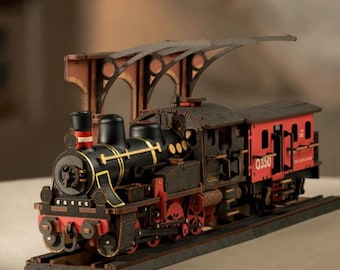 May include: A detailed wooden model of a vintage steam train, featuring black and red accents. The model includes a locomotive, a passenger car, and a track. The train has intricate details, including wheels, a smokestack, and a roof. The passenger car has the number "Q350" on the side.