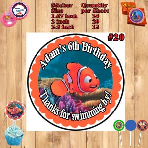 May include: Round orange and white sticker with a cartoon image of a clownfish swimming in the ocean. The sticker says "Adam's 6th Birthday" and "Thanks for swimming by!" in black text. The sticker is 2.5 inches in diameter.