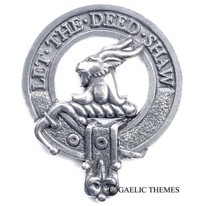 May include: A silver pewter clan crest featuring a goat's head with horns and the text "Let the Deed Shaw".