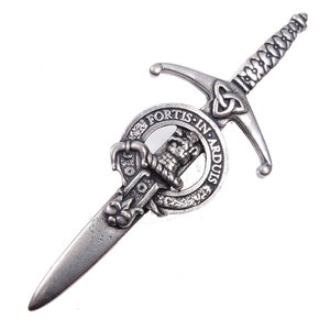 May include: Silver-toned kilt pin featuring a sword with a Celtic knot design and a circular crest with the text "Fortis in Ardous".