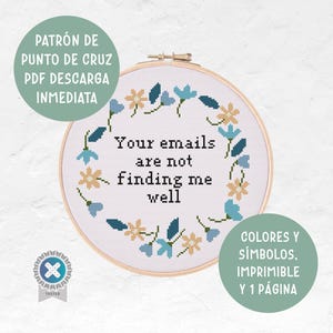 May include: A cross-stitch design in a wooden hoop features the text "Your emails are not finding me well" surrounded by blue and tan floral accents. The design includes the text "PATRÓN DE PUNTO DE CRUZ PDF DESCARGA INMEDIATA".