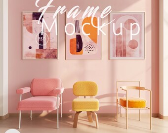 May include: Three framed abstract art prints with gold frames hang above three chairs. The chairs are pink, yellow, and beige. The text "Frame Mockup" is written across the top of the image.
