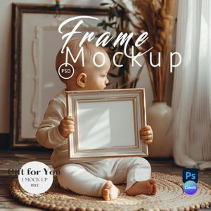 May include: A baby holding a rectangular, light-colored picture frame with a white interior. The frame has a decorative border. The image includes the text "Frame Mockup" and "Gift for You".