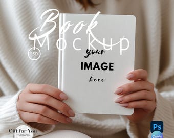 May include: A white book mockup with the text "Book Mockup" and "your IMAGE here" on the cover. The book is being held by a person wearing a white sweater.