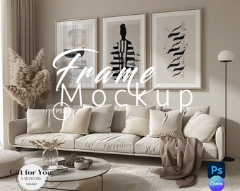 May include: A living room interior design mockup featuring three framed black and white abstract art prints hanging on a beige wall above a white sofa with pillows and a throw blanket. A round coffee table with a book and a vase with dried branches sits in front of the sofa. A tall floor lamp with a white shade is in the corner of the room. The text "Frame Mockup" is written in black on the wall.