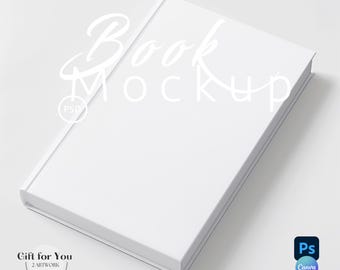 May include: A white book mockup with the text "Book Mockup" in white lettering. The book is lying flat on a white surface.