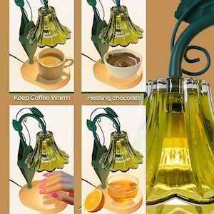 May include: A green and gold lamp with a wooden base, designed to keep coffee warm, heat chocolate, quickly dry nail polish, and warm spa essential oils. The lamp has a floral design and the text "Keep Coffee Warm", "Heating chocolate", "Quickly Dries Nail Polish", and "Heats & Warms Spa Essential Oils".
