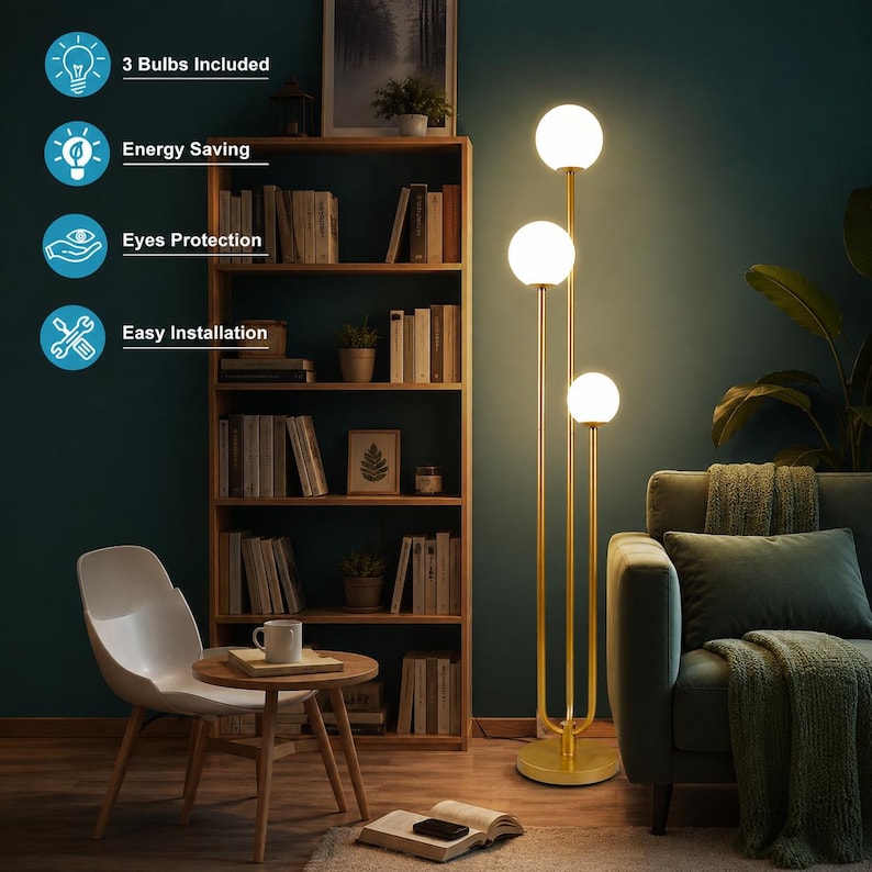 May include: A tall floor lamp with a gold-toned metal stand and three spherical white glass shades at varying heights. The lamp emits a warm glow. Text overlays indicate 3 Bulbs Included, Energy Saving, Eyes Protection, and Easy Installation.