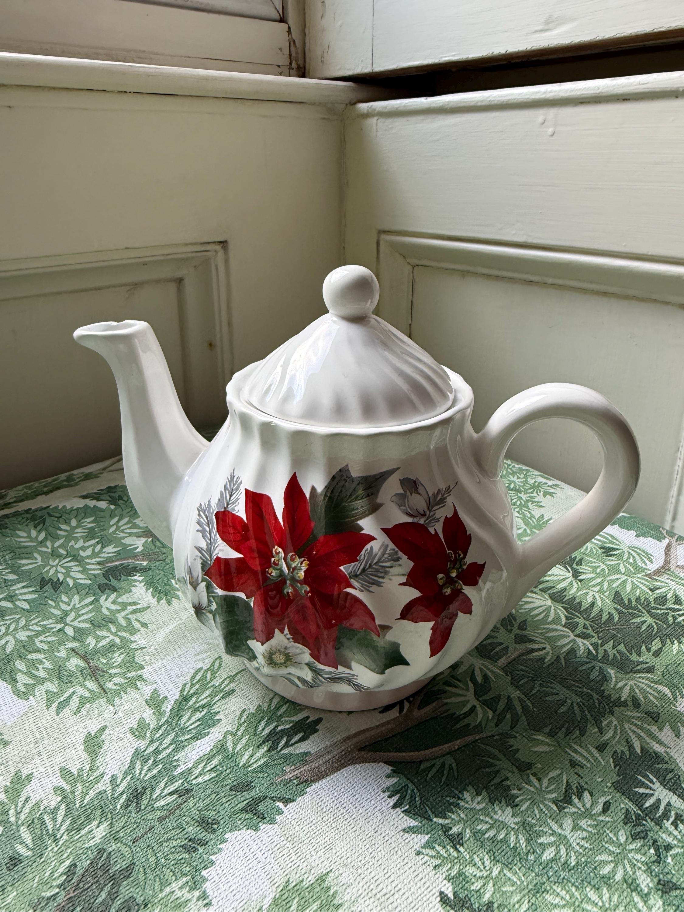 A vase of red poinsettias sits on a table 50695191 Stock Photo at