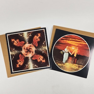 May include: Two greeting cards with brown envelopes. One card shows a collage of faces and a flower. The other card has a circular image of a couple holding hands on a beach at sunset.