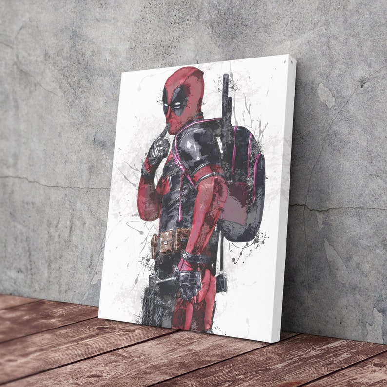 May include: A digital art print of Deadpool, a superhero character, in a red and black suit with a pink and black backpack. The background is white with black splatters of paint.