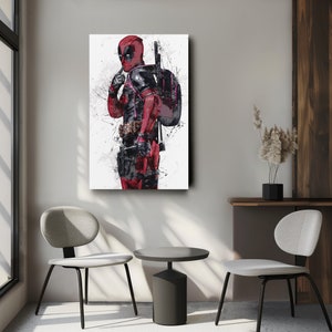 May include: A digital art print featuring a superhero character in a red and black suit with a sword and a backpack. The background is white with splashes of paint.