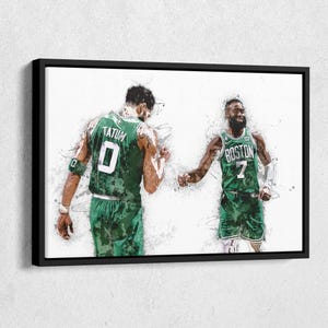 May include: A framed canvas print featuring two basketball players in green jerseys. One jersey reads "TATUM 0" and the other reads "BOSTON 7". The artwork has a watercolor effect with white and green tones.
