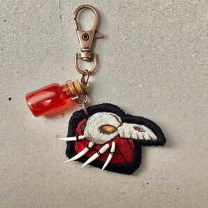 Pathologic Executor Hand Embroidery Keychain