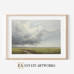 May include: A framed landscape painting depicting a field of green grass under a cloudy sky. The clouds are a light gray and white, and they cover most of the sky. The grass is a light green, and it is growing in a field that is bordered by trees in the distance.
