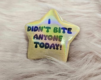 Insignia de estrella de 55 mm "¡Hoy no mordí a nadie!" Holográfica dorada.