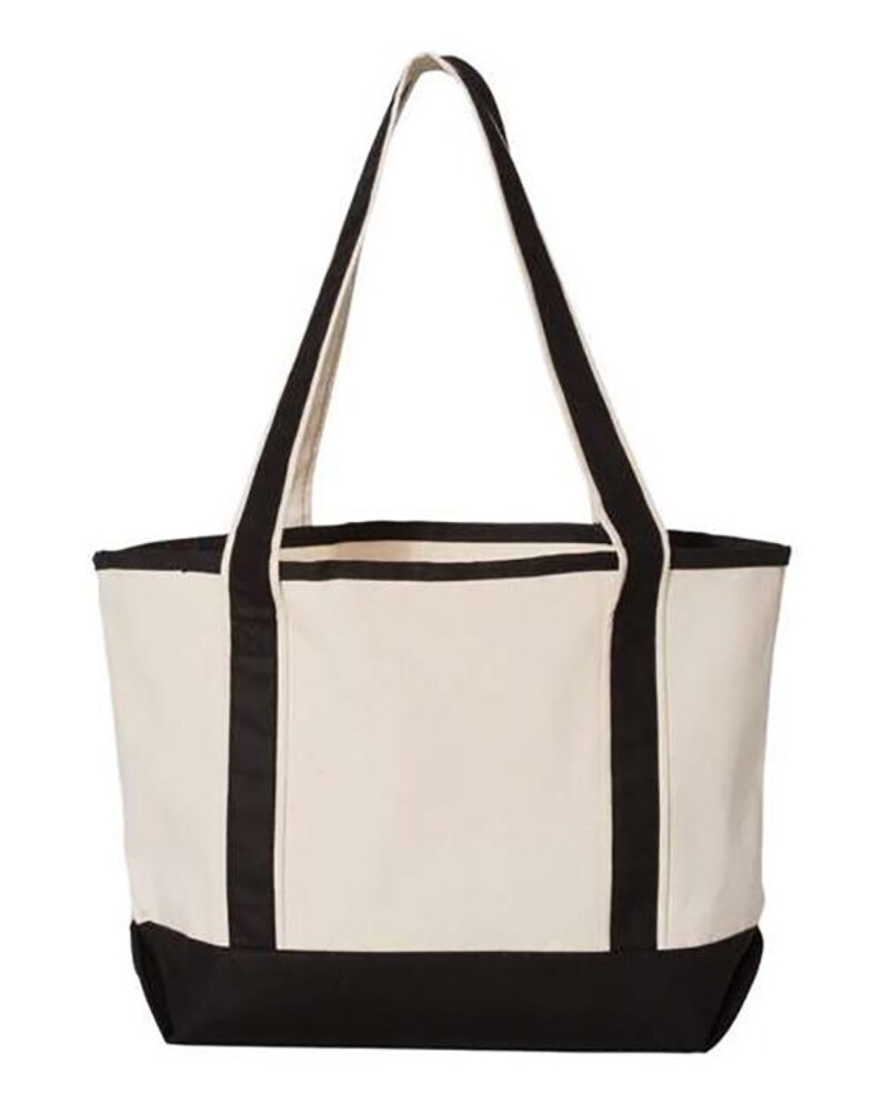 May include: A cream-coloured canvas tote bag with black detailing. The bag has black handles and a black base. The tote bag is designed for carrying items and has a simple, classic style.