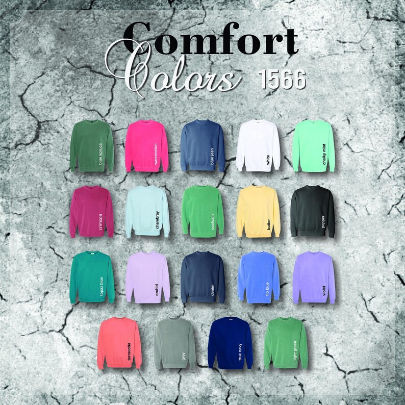Pode incluir: Uma exibi&ccedil;&atilde;o de camisolas de v&aacute;rias cores, incluindo verde, rosa, azul e branco. Cada camisola &eacute; rotulada com um nome de cor, como "blue jean" e "chalky mint". O texto "Comfort Colors 1566" est&aacute; no topo.