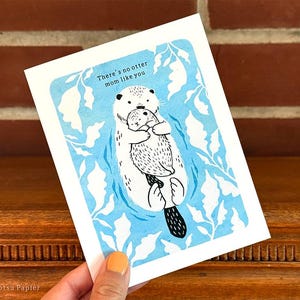 Close up of card being held to show size.