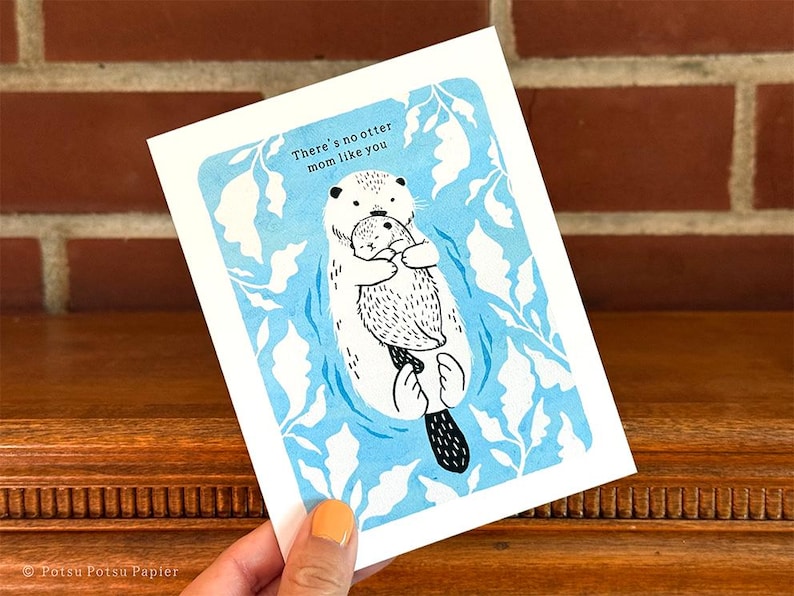 Close up of card being held to show size.