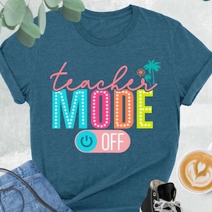 May include: A teal blue t-shirt with the text "teacher MODE OFF" in colorful letters with a light blue and pink power button graphic.