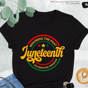 a black t - shirt with the words juneteeth on it