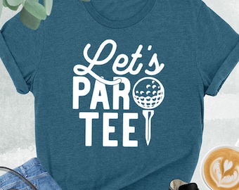 May include: A teal blue t-shirt with white text that says "Let's Par Tee" with a golf ball and tee graphic.