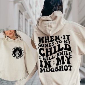 When It Comes To My Child I Will Smile In My Mugshot Hoodie, Sarcastic Mom Hooded Sweatshirt, Funny Mom Hoodie, Gift For Mom, Mom Gifts