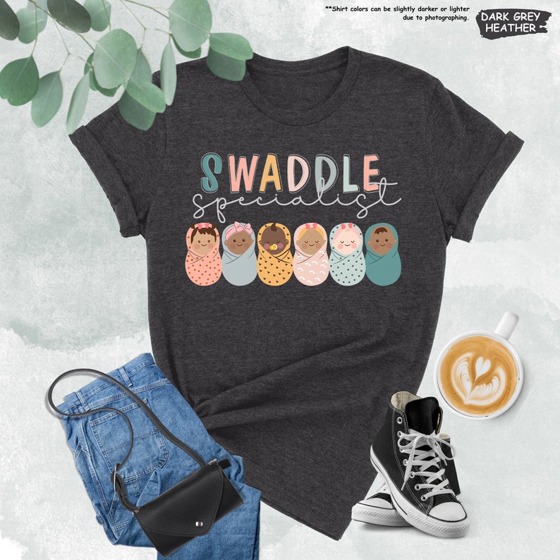 a t - shirt with the words swaddle spelled on it
