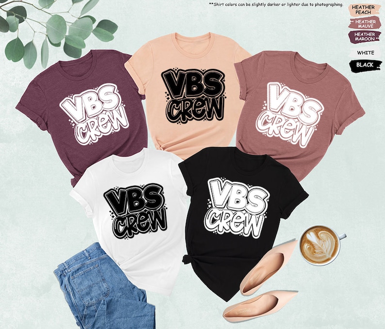 a group of t - shirts sitting on top of a table