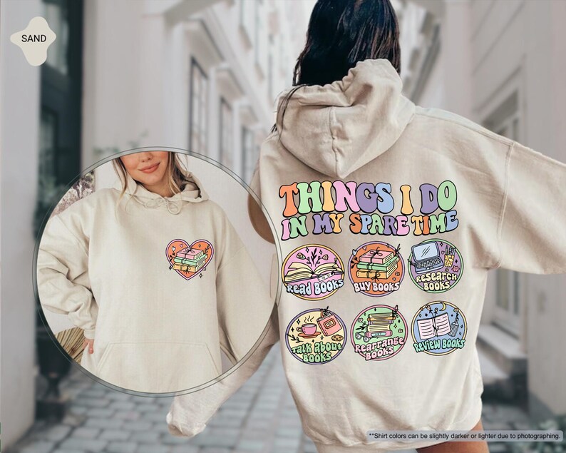 a woman wearing a white sweatshirt with patches on it