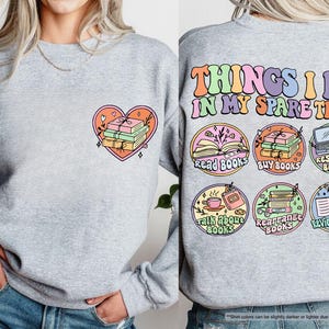 a woman wearing a sweatshirt with patches on it
