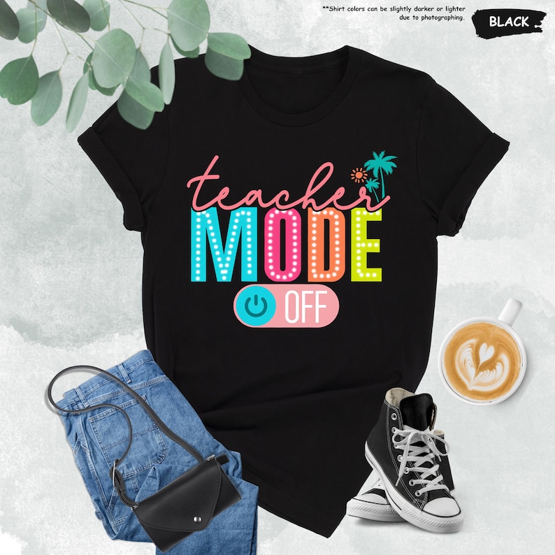May include: Black t-shirt with the text "teacher MODE OFF" in colorful letters with light bulbs around the letters. The text "OFF" is on a pink button with a power symbol.