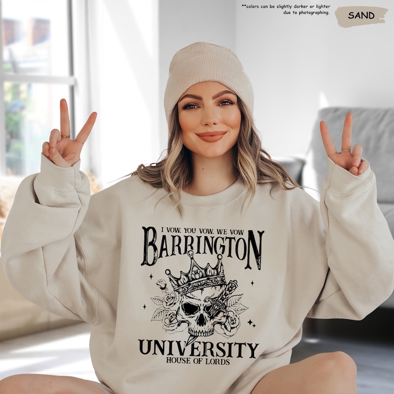 a woman wearing a sweatshirt with a skull on it