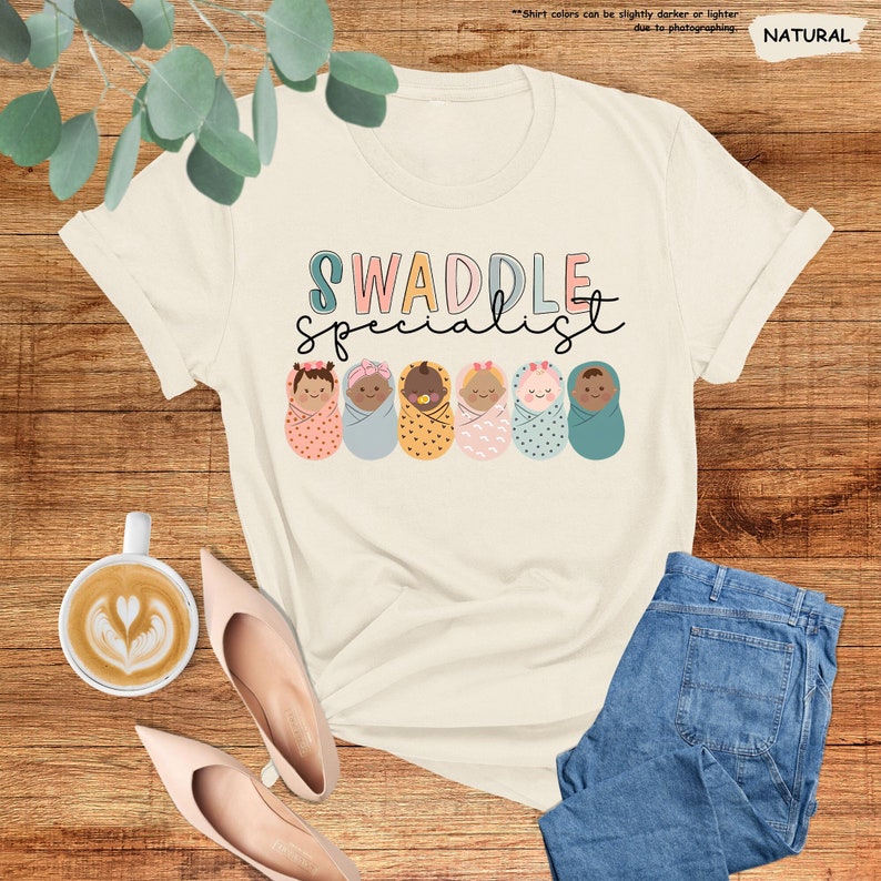 a t - shirt with the words swaddle squad on it