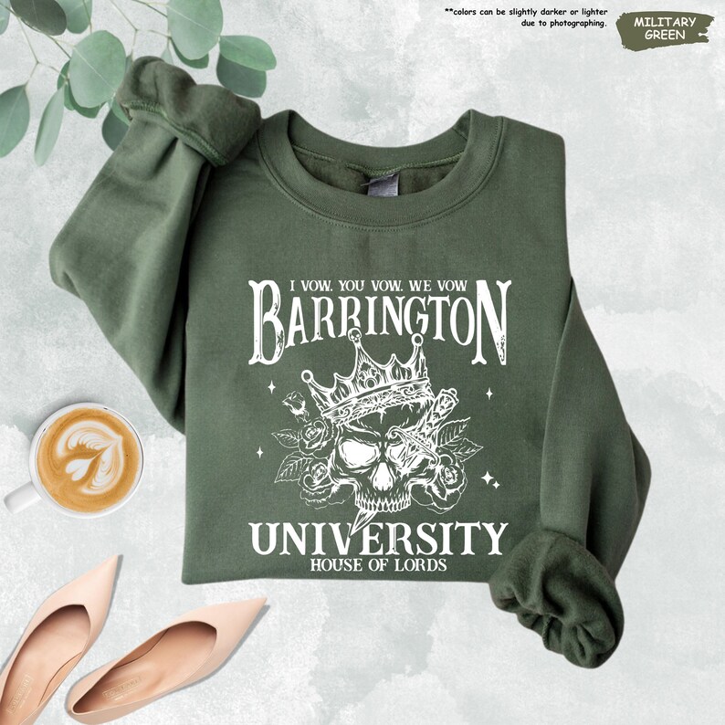 a green sweatshirt with a skull and crown on it