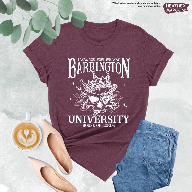 a t - shirt with a skull on it and a cup of coffee next to